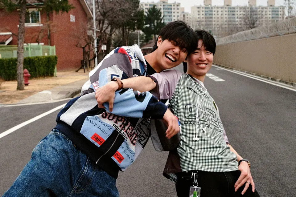 rom&BAAWLA striking a playful pose on a road